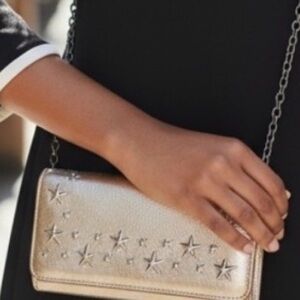 JIMMY CHOO. Wallet. Metallic gold  and silver studs. Chain included.